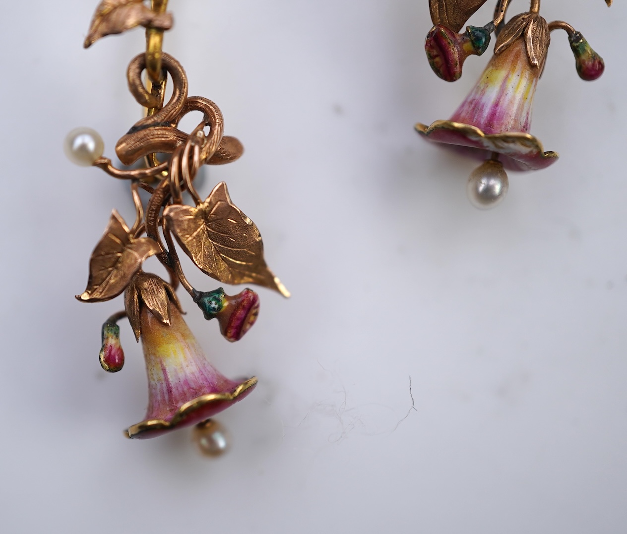 A rare pair of naturalistic gold, enamel and seed pearl earrings, circa 1850